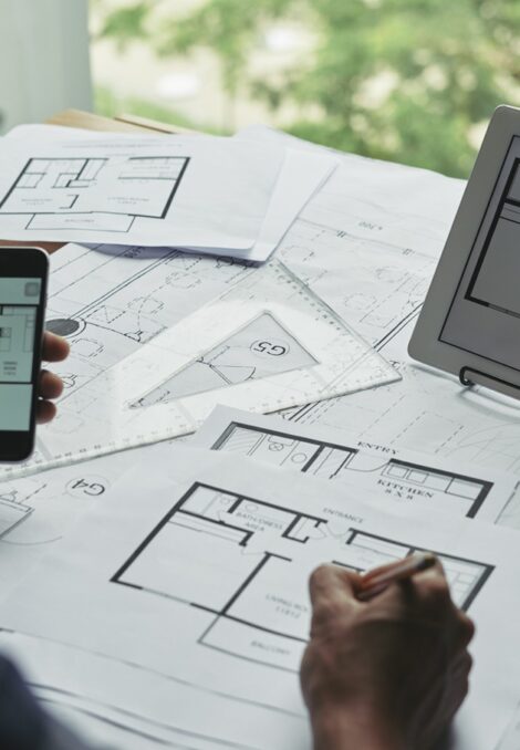Many blueprints of apartments on table of professional architect